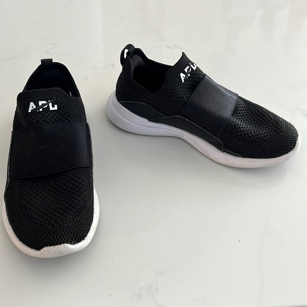 Black APL slip ons
